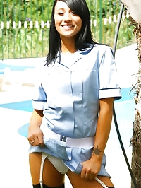 Penelope the dark haired beauty in a nurse uniform with..