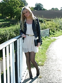 Gorgeous blonde Erin is outdoors showing off her shiny..